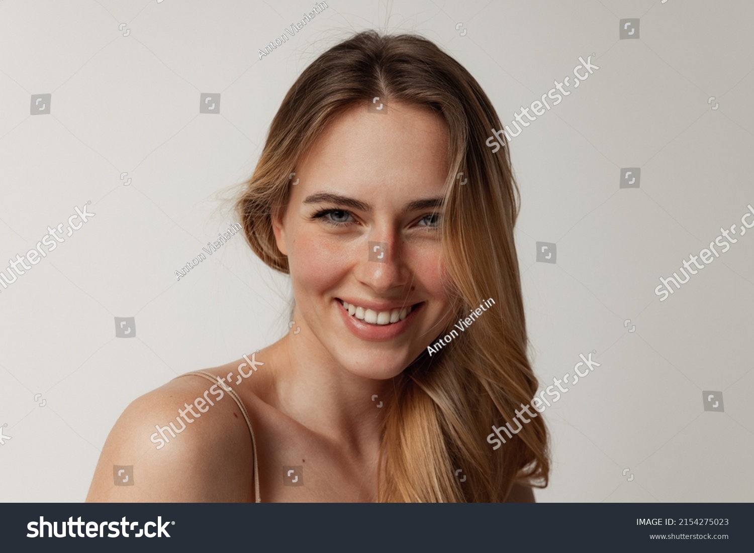 stock-photo-perfect-cosmetology-skin-care-portrait-of-tender-young-woman-with-perfect-face-smiling-at-camera-2154275023