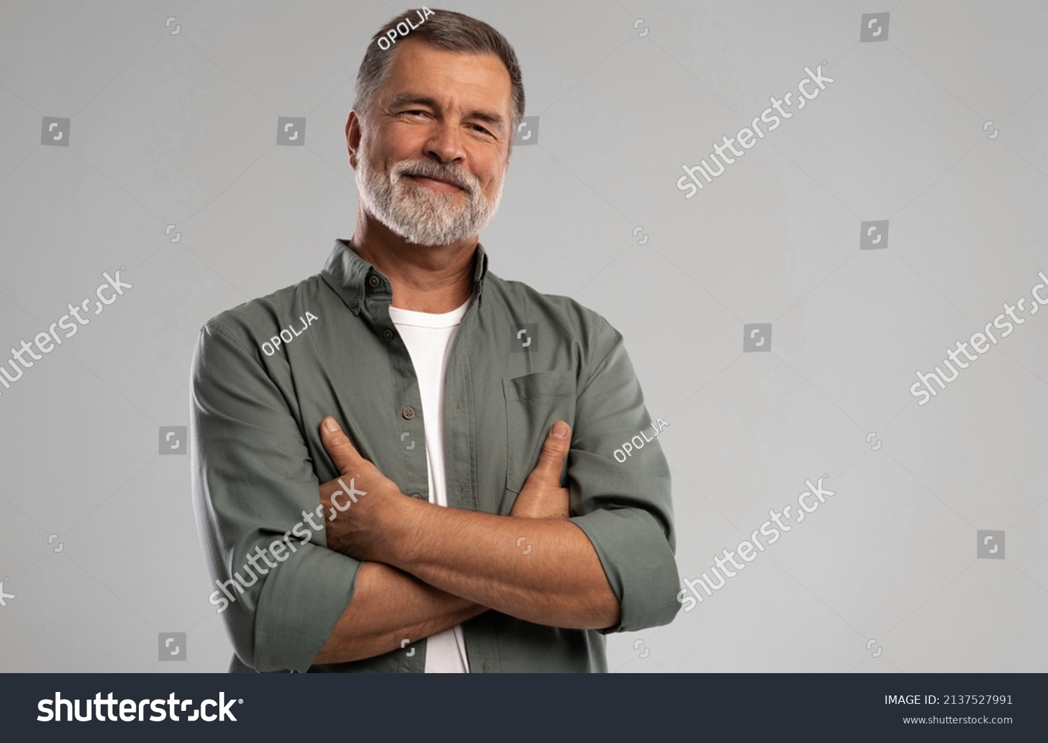 stock-photo-portrait-of-smiling-mature-man-standing-on-white-background-2137527991